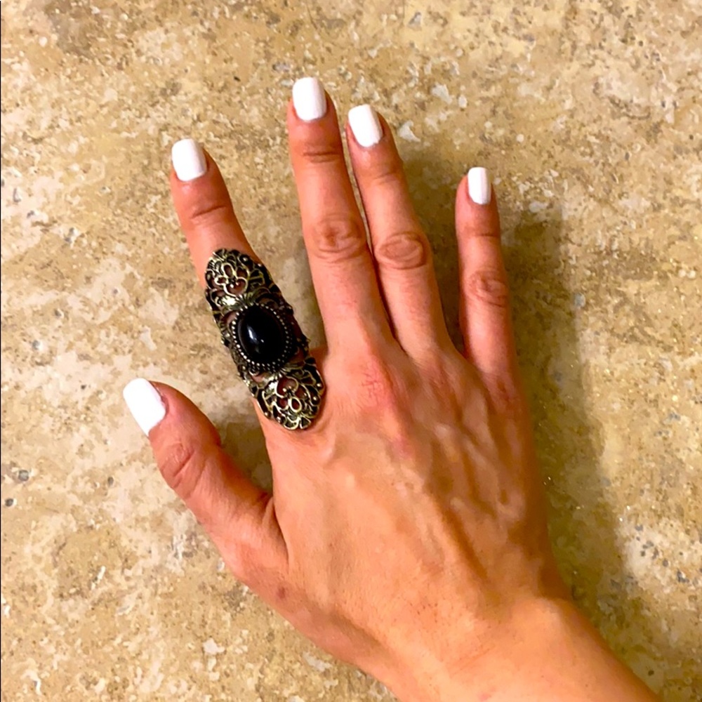 A vintage unique brass tall ring